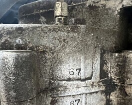 Engine displaying matching numbers on both belly pan cases.